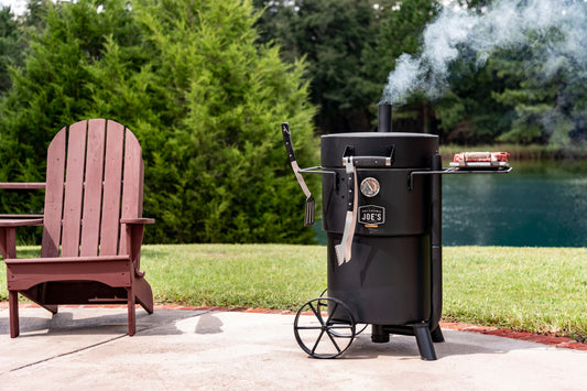 Why Gateway Drum Smokers Are a Must-Have for Competition BBQ by the serene lake with outdoor grilling setup.