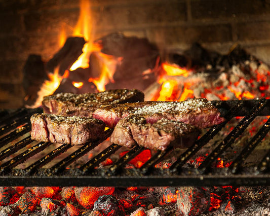 Master the Art of Memphis Competition Cooking with Sweet Swine O' Mine, steaks grilling over open flames.