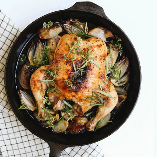 Field Company No.10 Cast Iron Skillet with roasted chicken and vegetables, ideal for grills smokers and cookers.