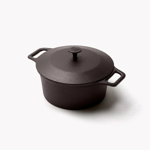 Field Company No.8 Cast Iron Dutch Oven for grilling, perfect for outdoor cooking with BBQ accessories.
