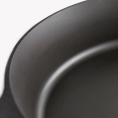 Close-up of the smooth interior of the Field Company No. 6 Cast Iron Skillet, ideal for searing and sautéing.