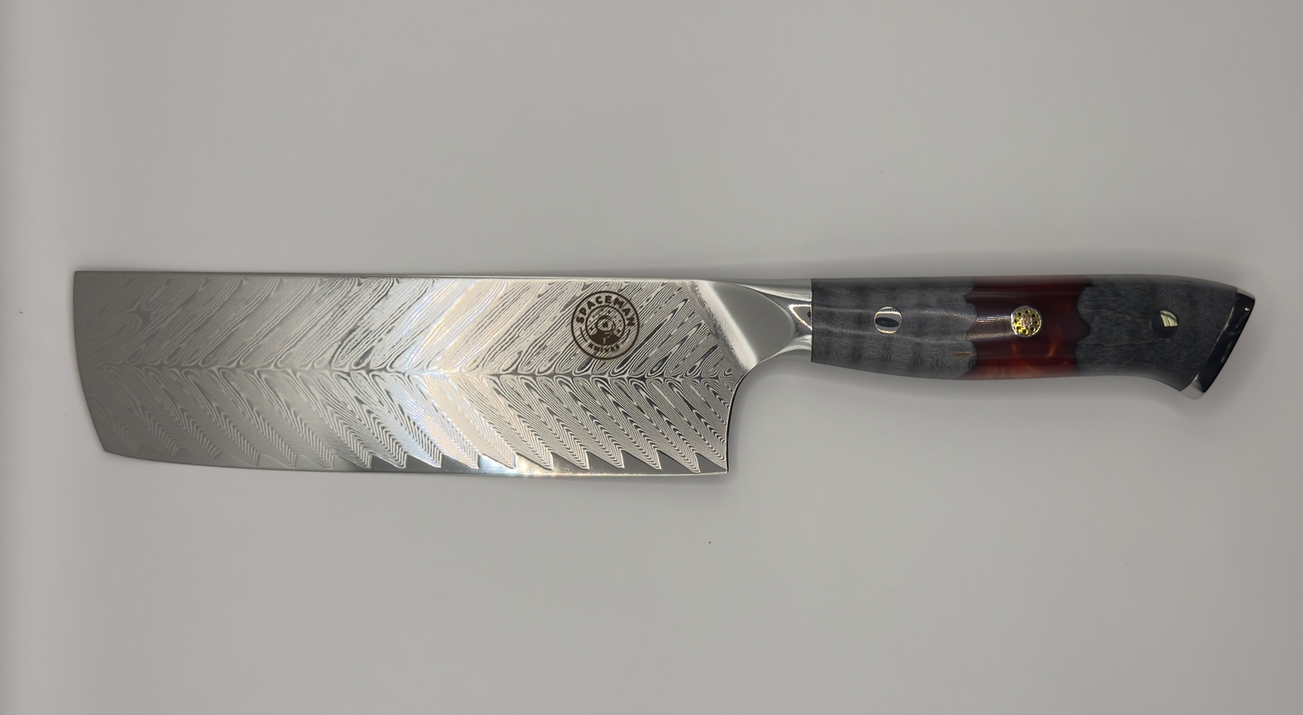 Spaceman Triton Nakiri knife with feathered VG-10 steel blade and dark gray fire red epoxy handle.