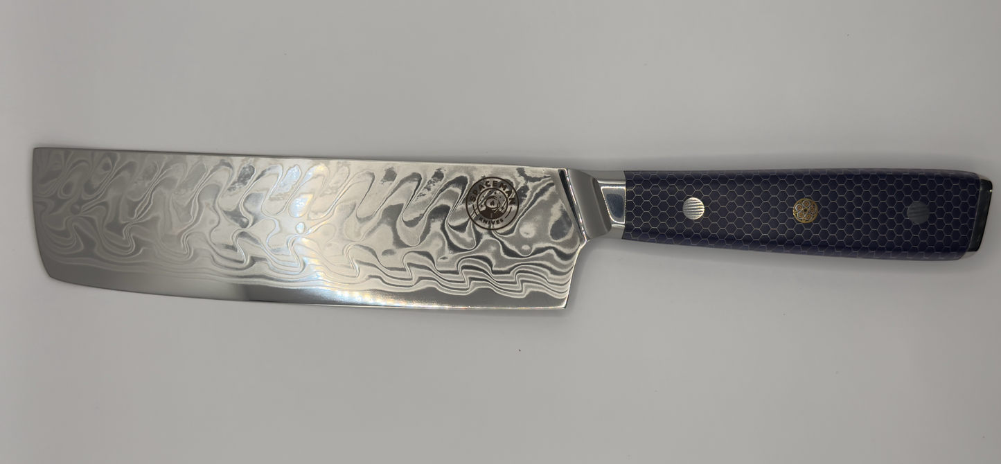 Spaceman Interstellar Blue Nakiri with Damascus finish and blue honeycomb handle, perfect for grilling and barbecue preparation.