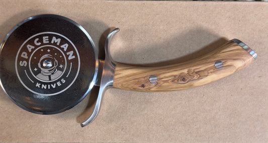 Spaceman Pizza Wheel with a sleek Damascus blade and elegant wooden handle for perfect pizza slices.