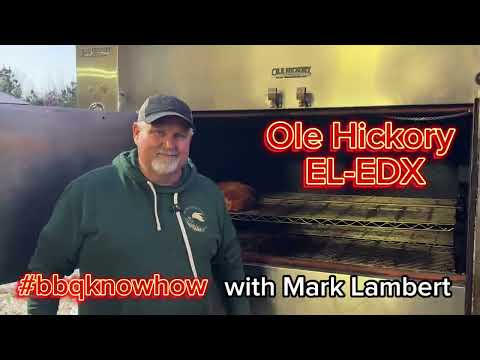 Mark Lambert showcasing the Ole Hickory EL-EDX Rotisserie Smoker Oven in a BBQ demonstration.