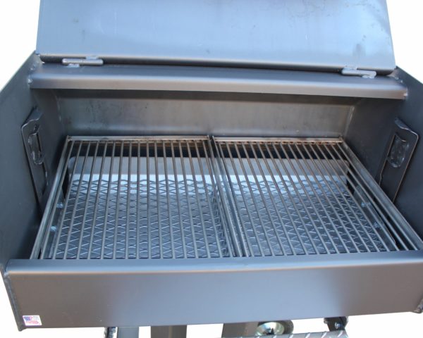 Interior view of RV Works CC JR Charcoal Grill with stainless steel grates for versatile cooking.