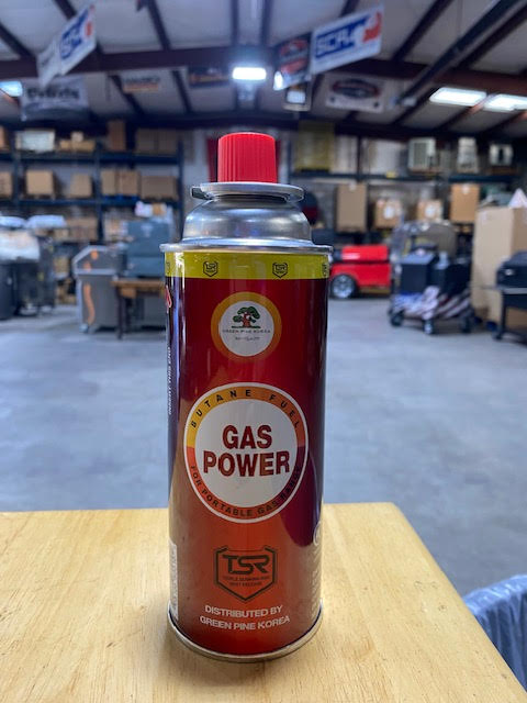 8oz Butane Bottles for Portable Gas Range in a workshop setting, ideal for grills smokers and cookers.