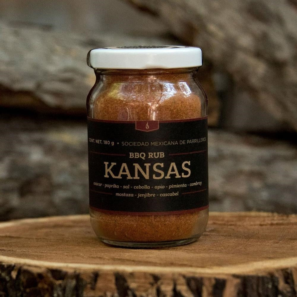 SMP rub in a glass jar on a wooden surface, perfect for enhancing flavors in grills, smokers, and cookers.