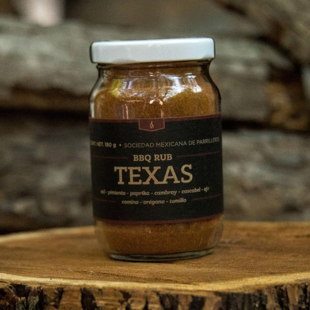 SMP rub in a glass jar with a black label, perfect for grills smokers and cookers, enhancing BBQ flavors.