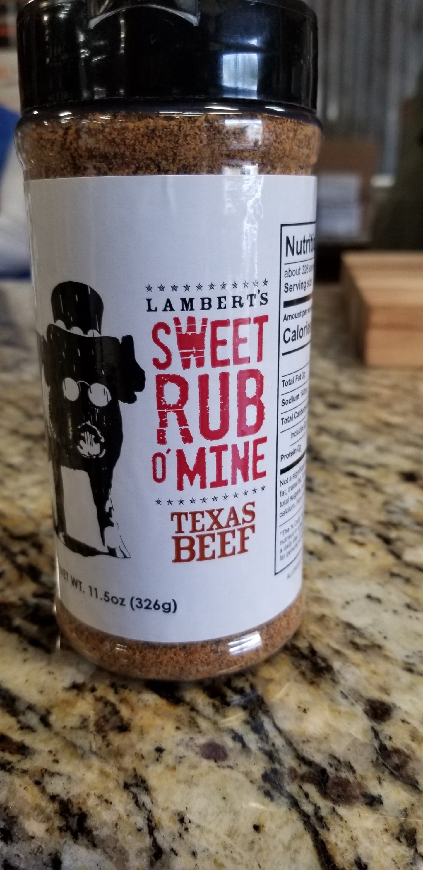 Sweet Rub O' Mine Texas Beef Rub 11.5oz on kitchen counter, ideal for BBQ enthusiasts and grilling accessories.
