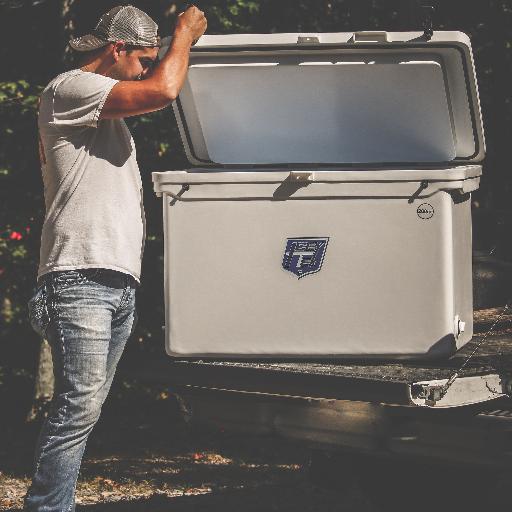 ICEY-TEK 200 Quart Cooler (FREE SHIPPING) shown in use for outdoor adventures and camping.