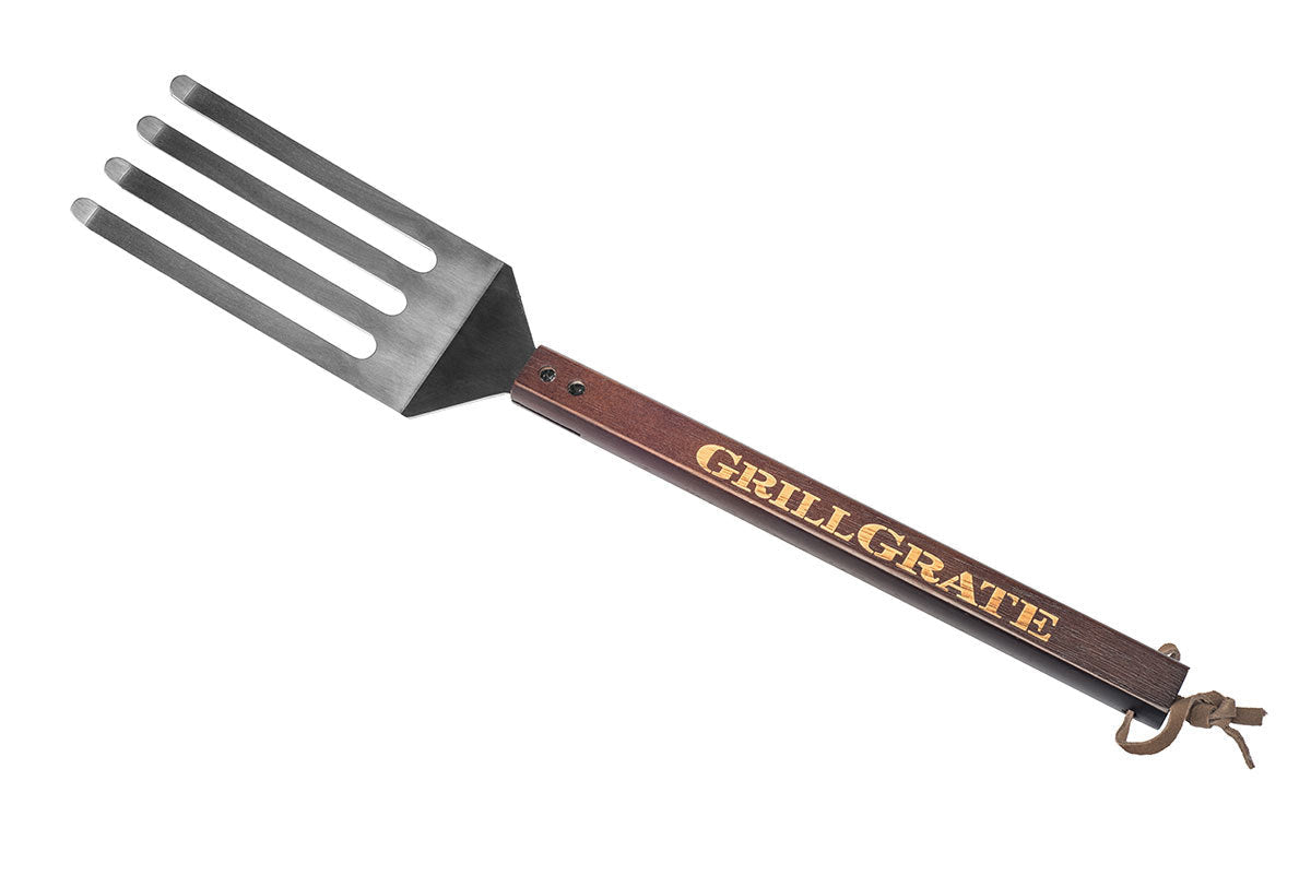 GrillGrate Tool for outdoor grilling, part fork and spatula, perfect for cleaning grills and smokers.