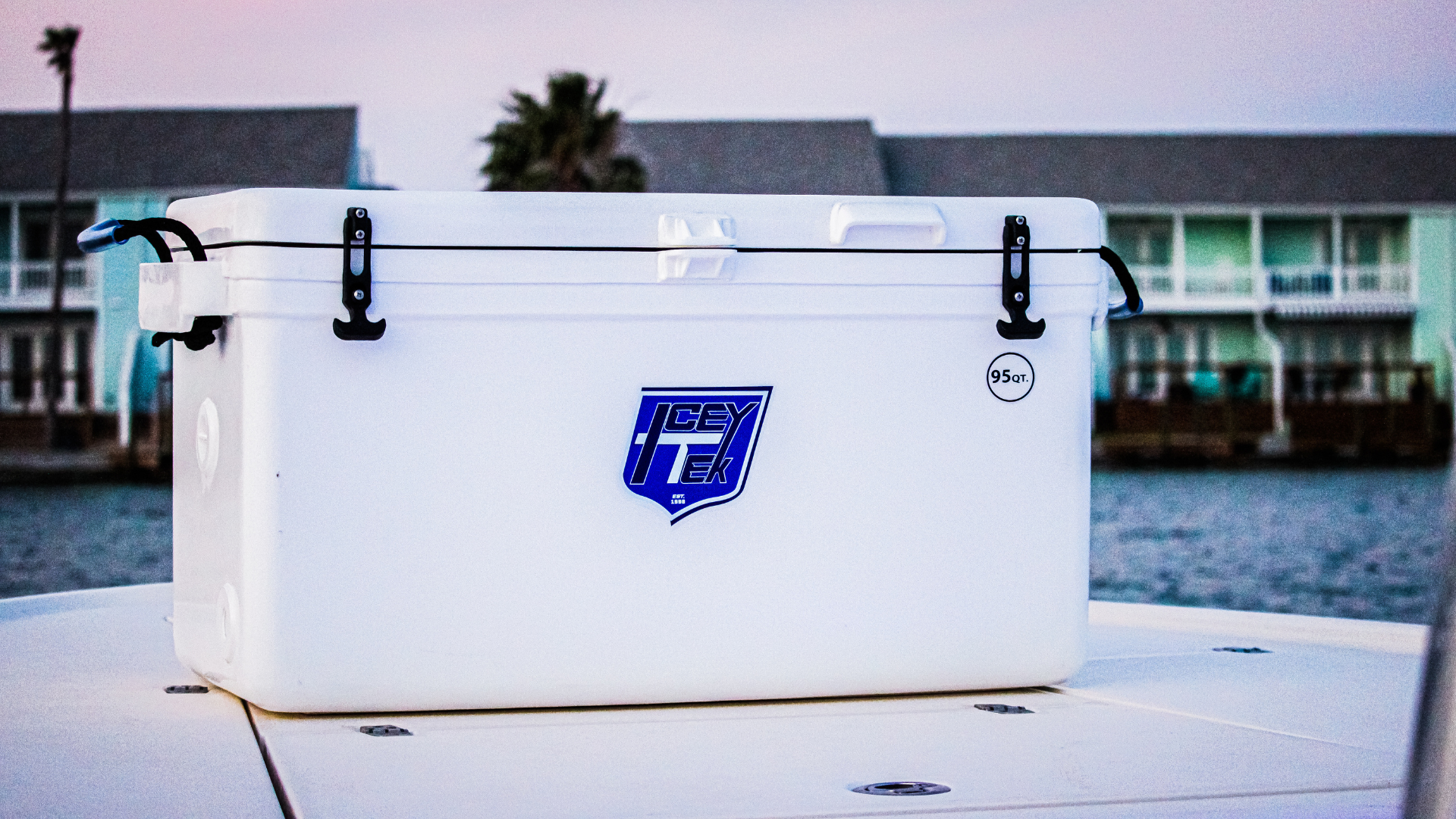 ICEY-TEK 95 Quart Cooler (FREE SHIPPING) on a boat deck, perfect for outdoor cooking and camping excursions.