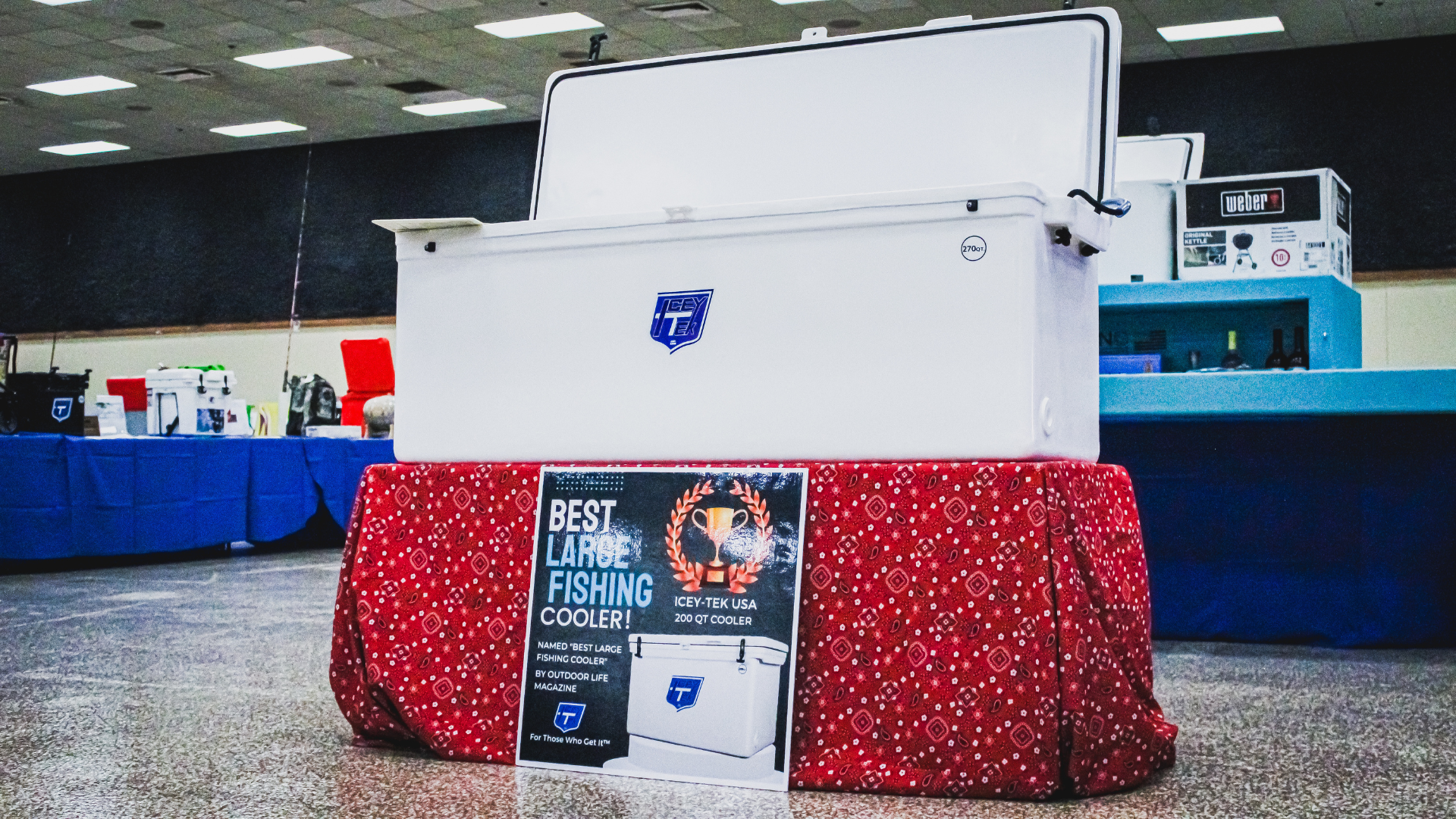 ICEY-TEK 270 Quart Cooler ( FREE SHIPPING) displayed at event with award sign and promotional material.