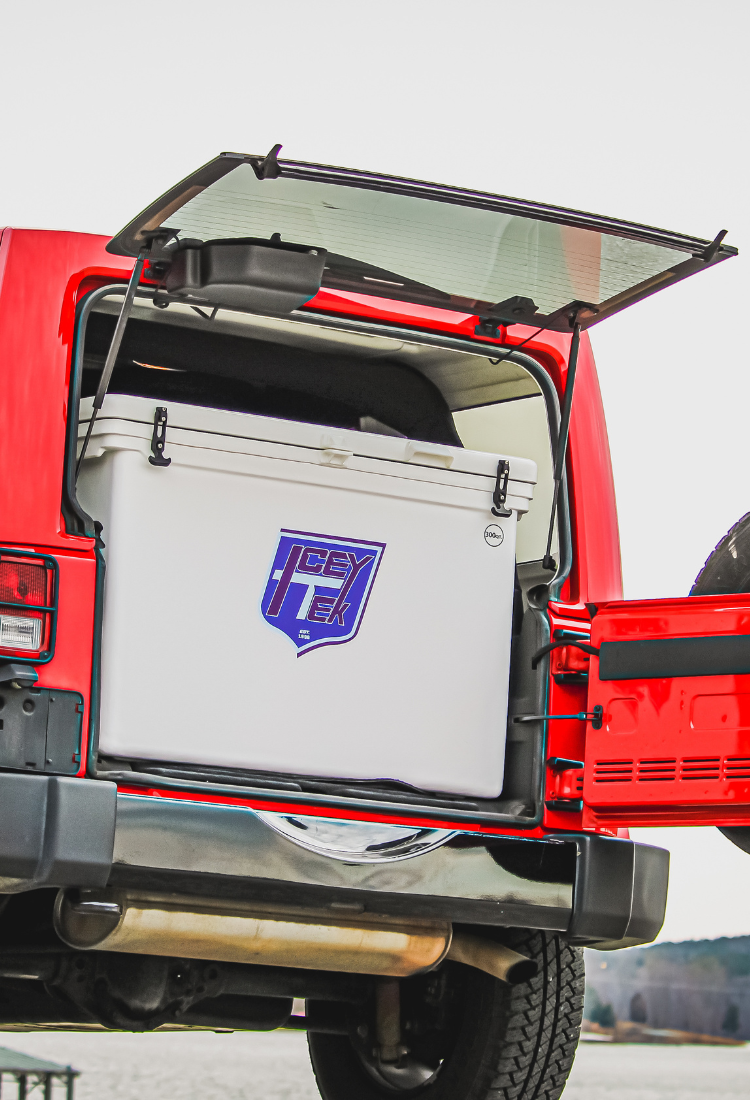 ICEY-TEK 300 Quart Cooler (FREE SHIPPING) in the back of a truck, showcasing its durable design and easy access.