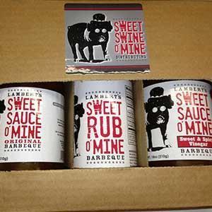 Sweet Swine O' Mine Gift 6 Pack with original and sweet vinegar sauces and BBQ rub, designed for outdoor grilling.