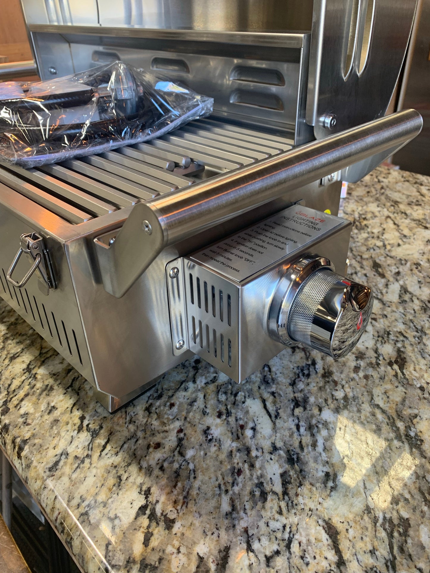 Blaze PRO Portable Grill LP Gas showcasing its stainless steel finish and built-in controls for outdoor grilling.