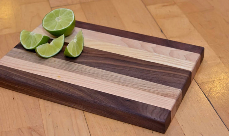 Coastal Carolina Cutting Boards 1" x 8" x 12" Traditional Cutting Boards with sliced limes on top.