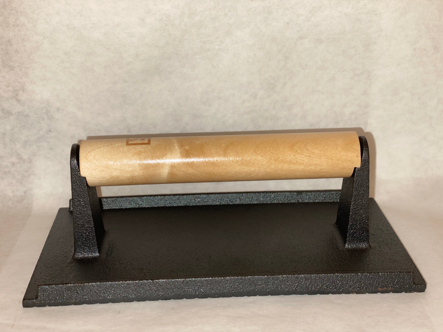 8"x4" cast iron Steak Weight for grilling, ideal for use with grills, smokers, and cookers for perfect cooking results.