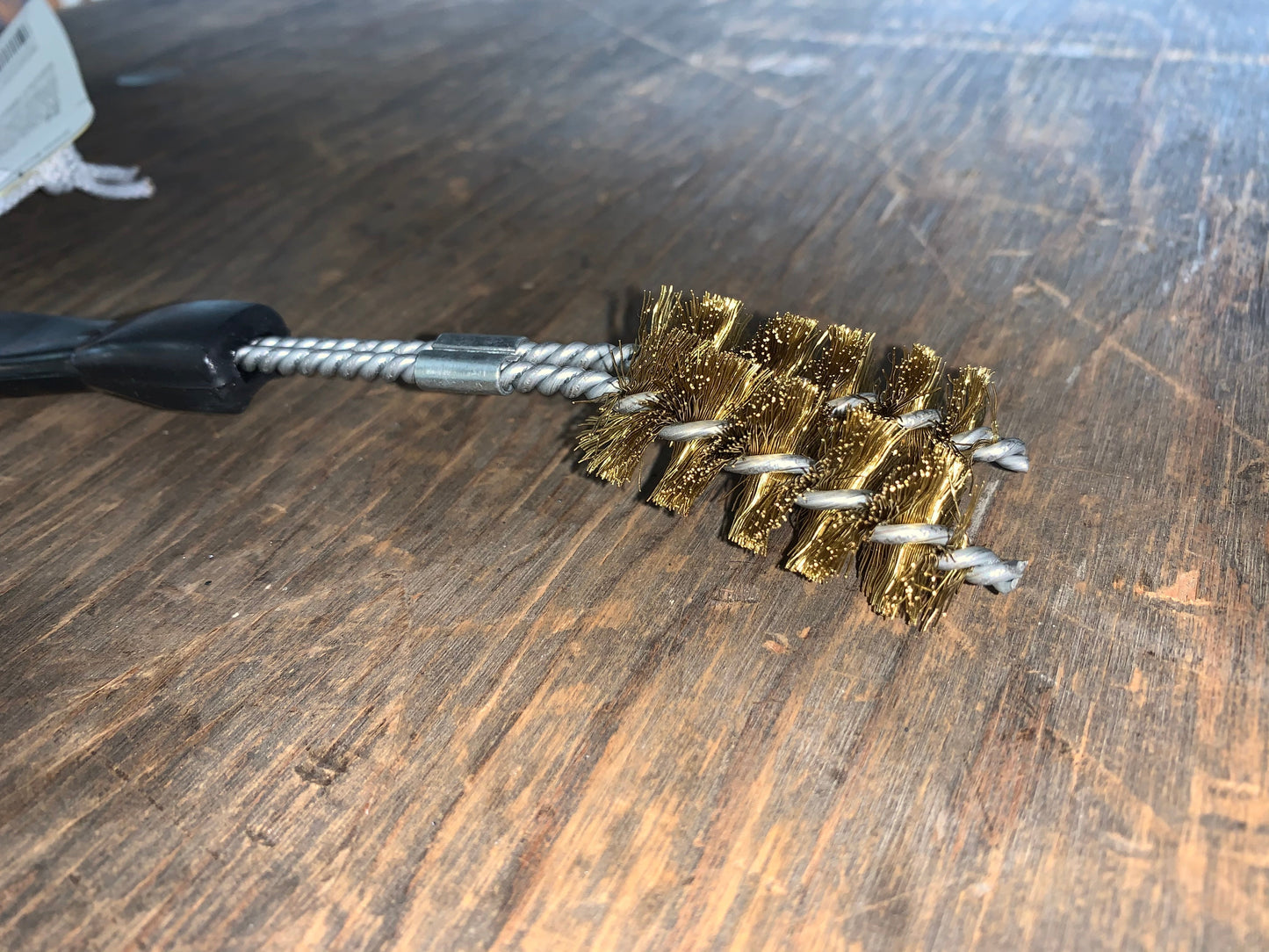 Close-up of Brushtech two prong V-shape barbecue grill brush #B10C, ideal for cleaning grills, smokers, and cookers.