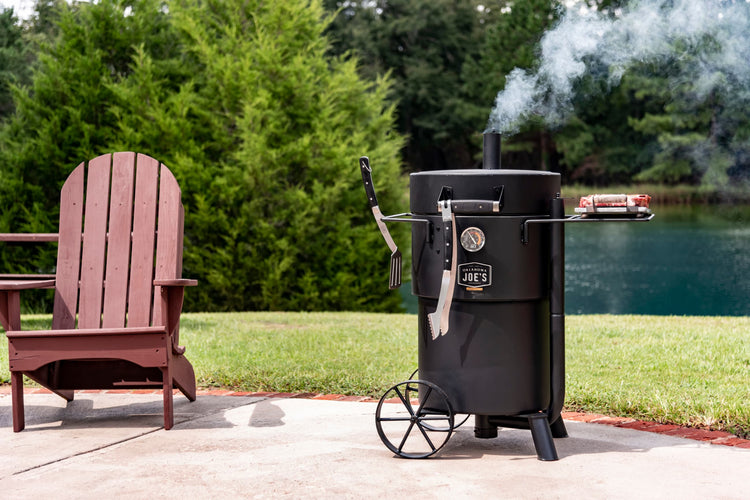 Why Gateway Drum Smokers Are a Must-Have for Competition BBQ by the serene lake with outdoor grilling setup.