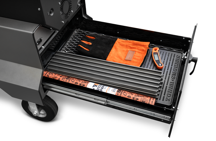 Yoder Smokers YS640s (Black) Pellet Grill on Competition Cart with Drawer System showcasing grilling tools and accessories.