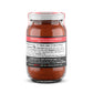 SMP Rub Rojo in a glass jar, perfect for enhancing flavors in grills, smokers, and outdoor cookers.
