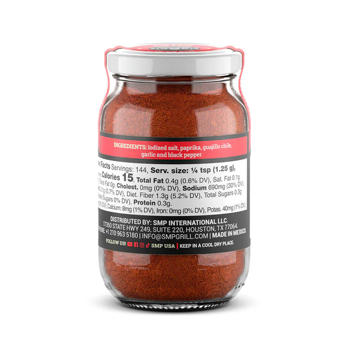 SMP Rub Rojo in a glass jar, perfect for enhancing flavors in grills, smokers, and outdoor cookers.