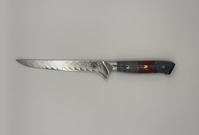 Spaceman Triton Boning Knife with a beautiful feathered VG-10 steel blade and epoxy handle, perfect for grilling enthusiasts.