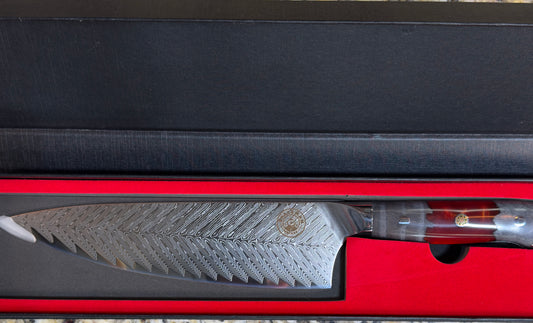 Spaceman Triton Chef Knife displayed in stylish box, showcasing VG-10 steel blade and beautiful epoxy handle.