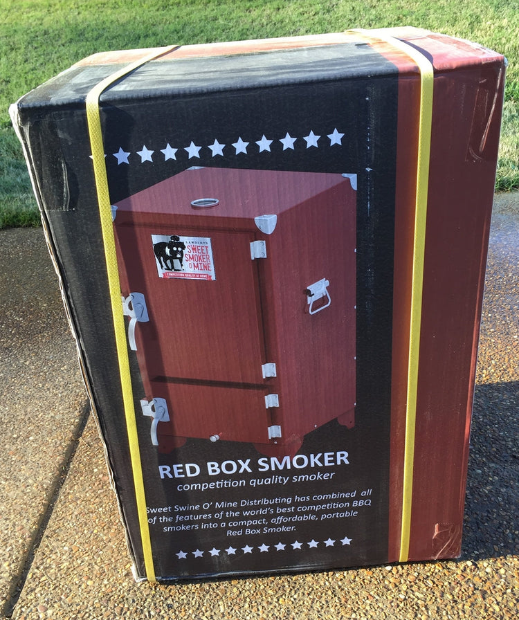 Red Box Smoker (firebox insert not included) packaged for delivery, featuring competition quality design and branding.