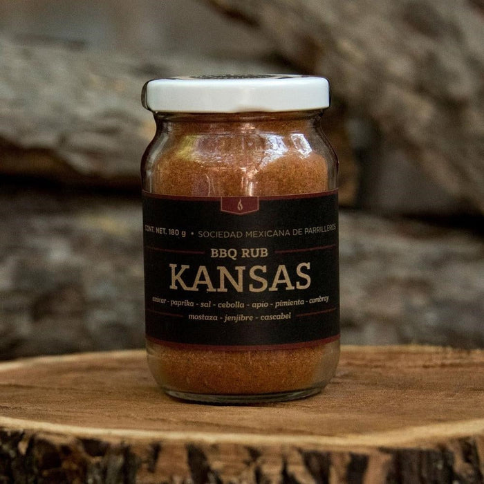 SMP rub in a glass jar on a wooden surface, perfect for enhancing flavors in grills, smokers, and cookers.