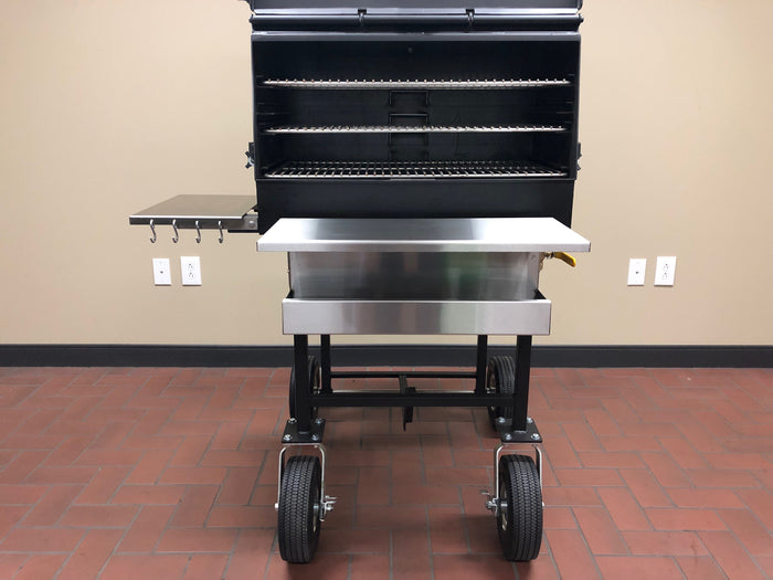 American Barbecue Systems All Star Smoker featuring stainless steel racks and cooking tools for backyard enthusiasts.