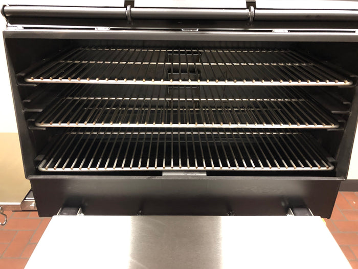 American Barbecue Systems All Star Smoker with three stainless steel smoking racks designed for backyard barbecue enthusiasts.