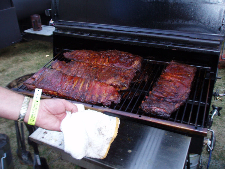 American Barbecue Systems All Star Smoker grilling tender ribs with rich barbecue flavor.