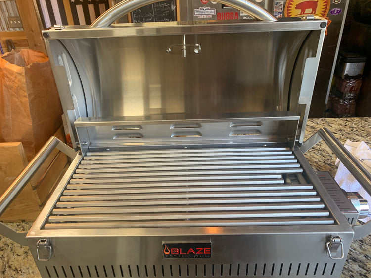 Open Blaze PRO Portable Grill LP Gas showcasing stainless steel cooking rods for outdoor grilling.